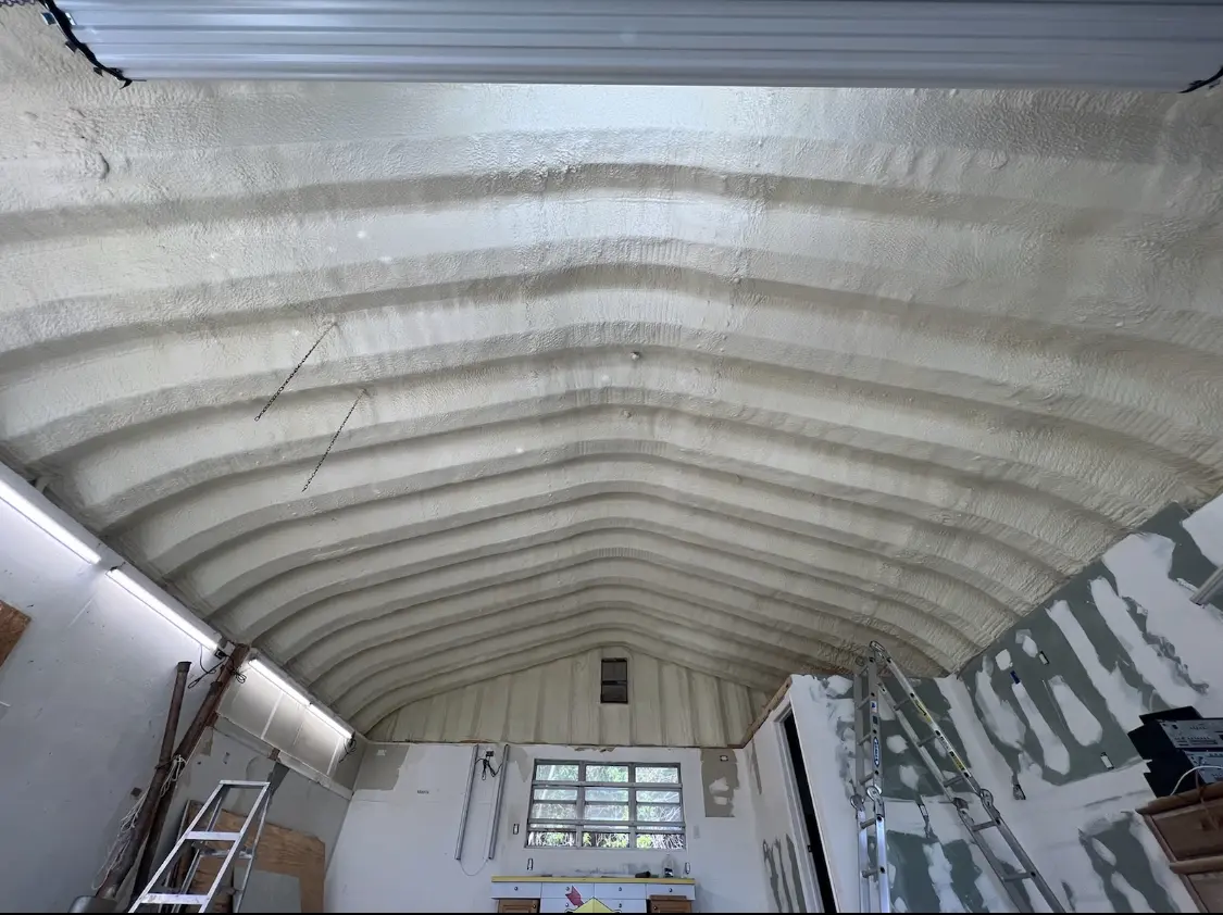 Spray polyurethane foam applied to the underside of a metal roof deck in Salida del Sol Estates